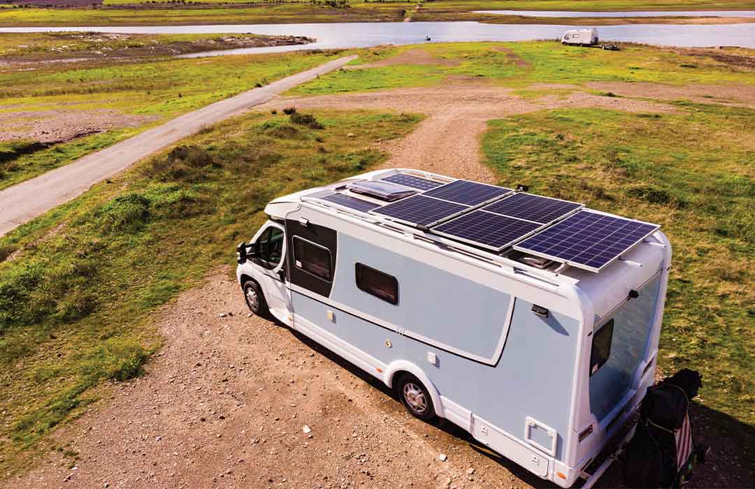Camper van with solar panels in scenic location